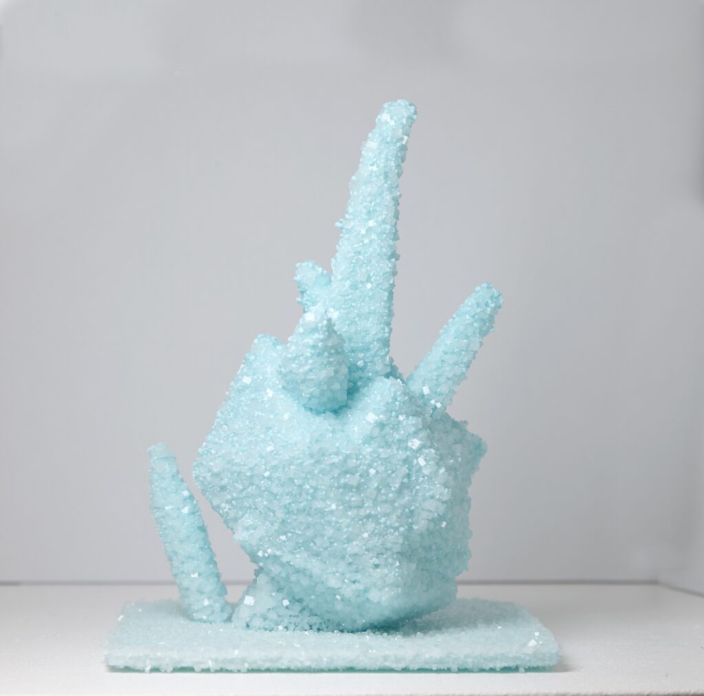 Mathias Kessler, Model for Future City’s, 2019. 3D-printed honeycomb structure with crystal growth (growing architecture), ca. 14 × 12 cm (varying dimensions). Unique.