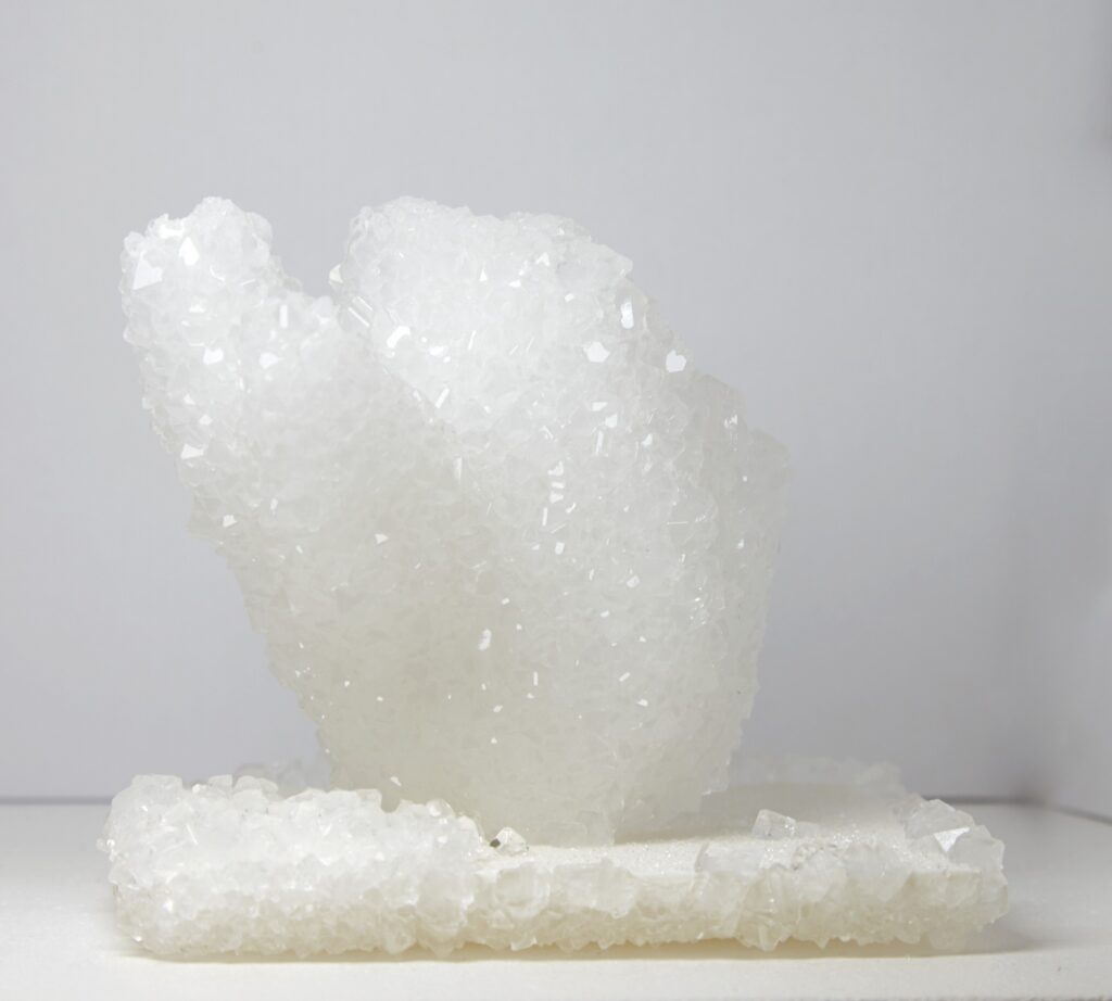 Mathias Kessler, Model for Future City’s, 2019. 3D-printed honeycomb structure with crystal growth (growing architecture), ca. 14 × 12 cm (varying dimensions). Unique.