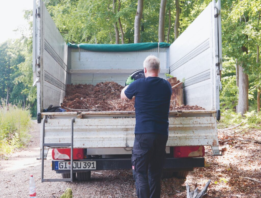 Truck being loaded with forest material