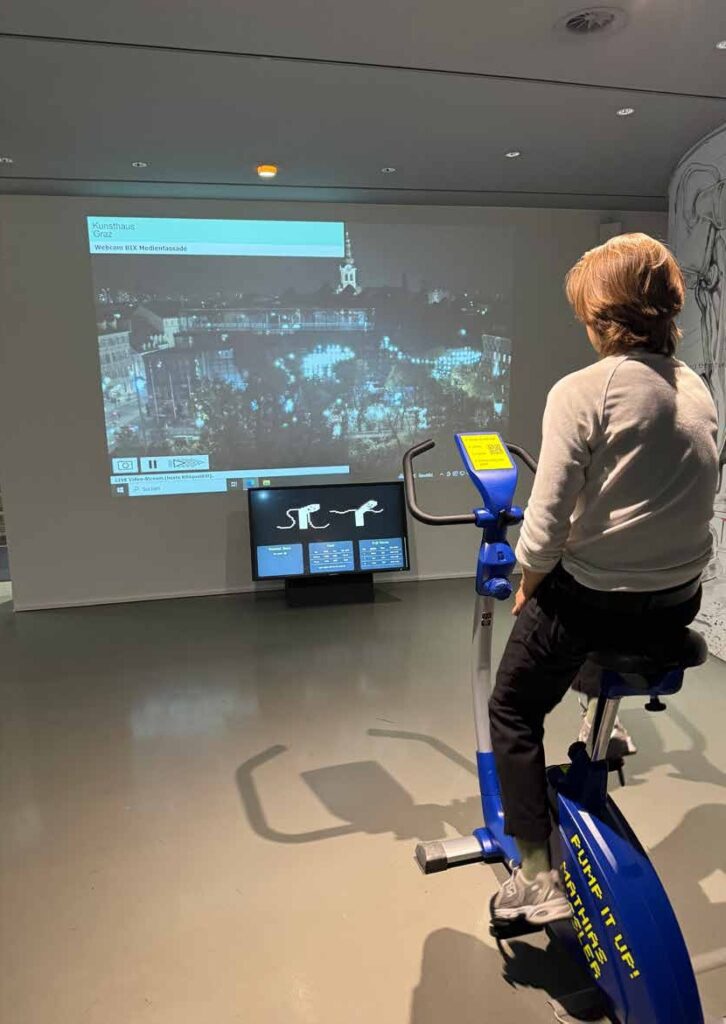 Pump it Up!, Kunsthaus Graz, 2024. Visitor on the stationary bike