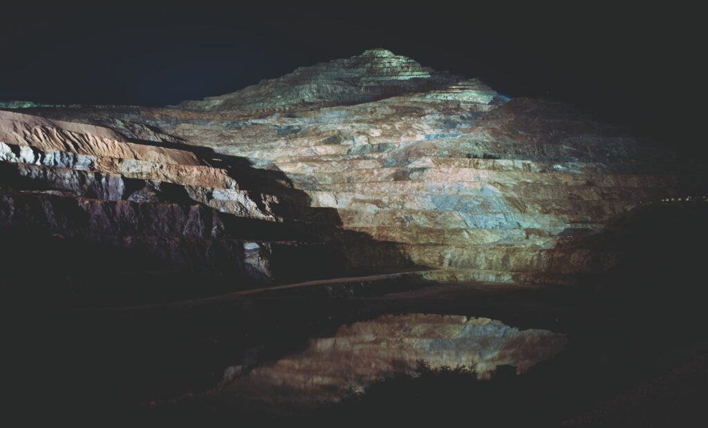 Erzberg 01 — the terraced Erzberg iron-ore mine at Eisenerz, Styria, lit at night and reflected in a pool, 2004