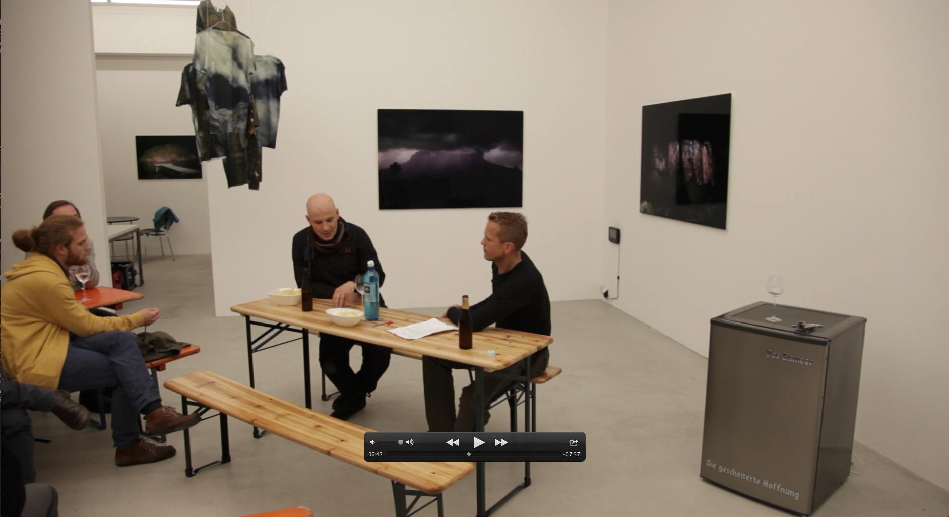 The Das Eismeer fridge piece visible beside the beer table during the gallery talk at Galerie Heike Strelow, Frankfurt, 2012